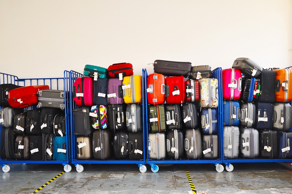 Luggage piled up on carts